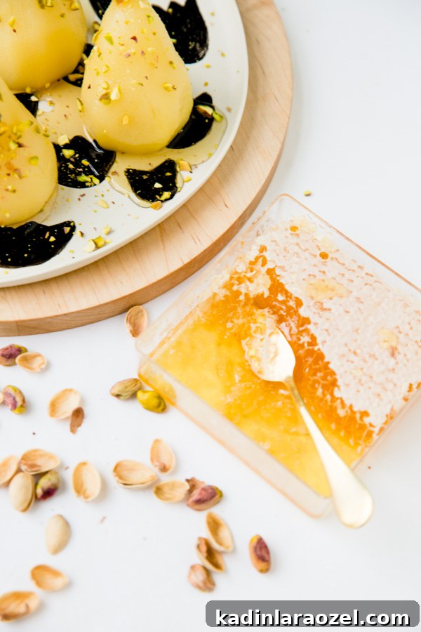 Boozy poached pears with drizzled honey and pistachios