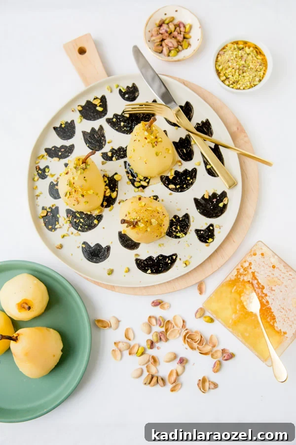 Recipe for boozy poached pears with drizzled honey and pistachios