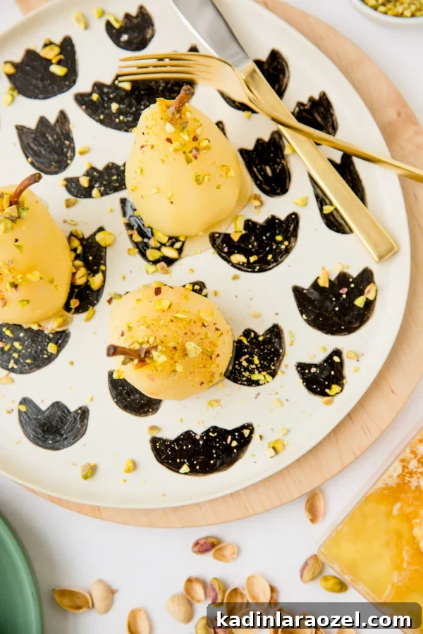 Boozy poached pears with drizzled honey and pistachios