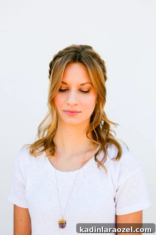 Quick Half-Halo Braid Tutorial: Style It in 10 Minutes 3 Woman with wavy hair, with half halo braid.