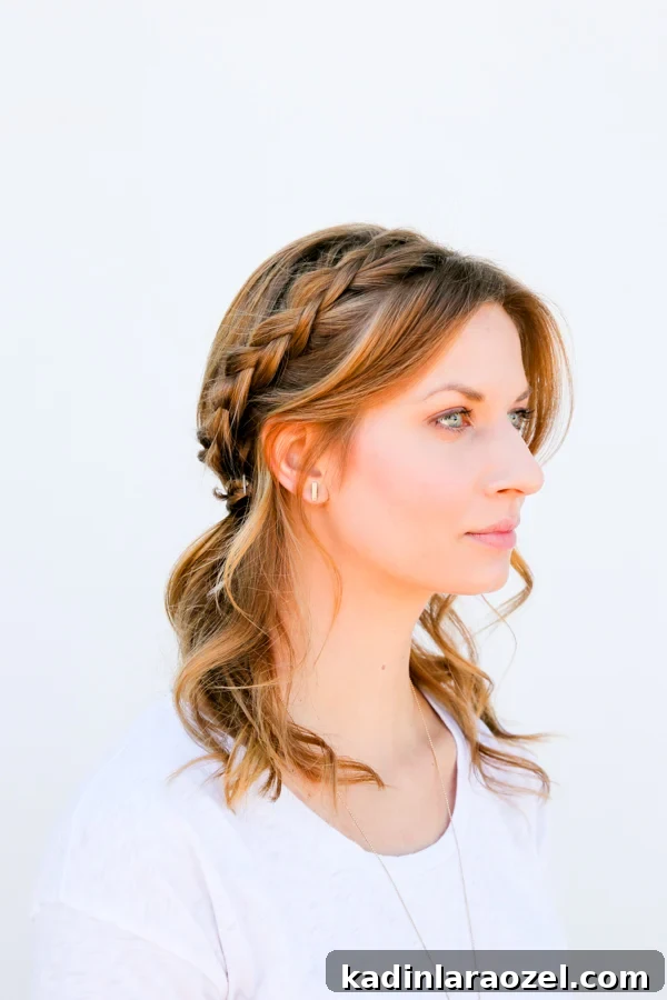 Quick Half-Halo Braid Tutorial: Style It in 10 Minutes 7 Side profile of woman wearing half halo braid with wavy hair.