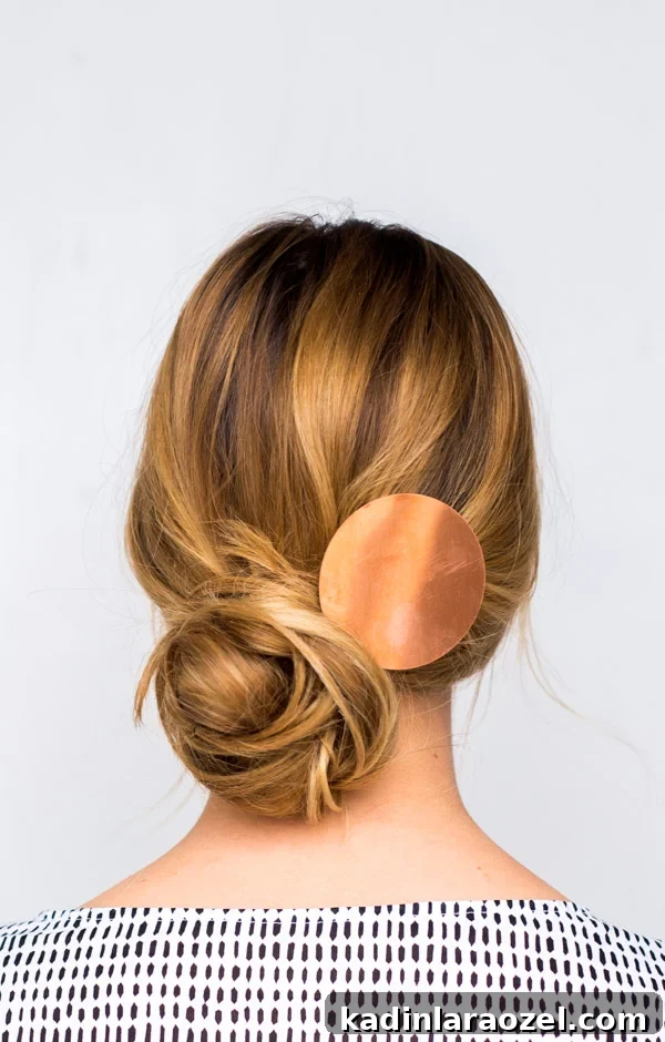 How to Create a Side-Swept Chignon: Step-by-Step Tutorial 2 Woman wearing messy, side swept chignon hair style
