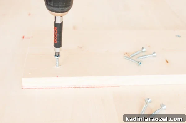 Drilling in the supports for the DIY tables