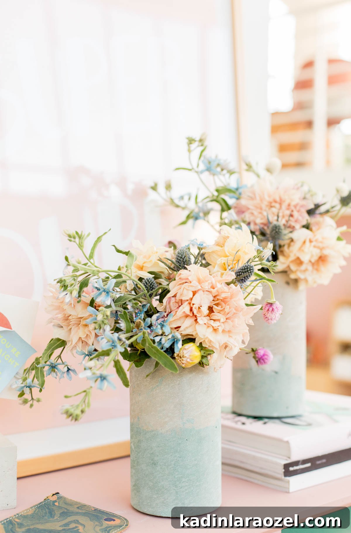 Coloring Concrete: Step-by-Step Guide to Make a Stylish Concrete Vase 7 Concrete vases with beautiful wildflowers in each vase, sitting on a pink countertop