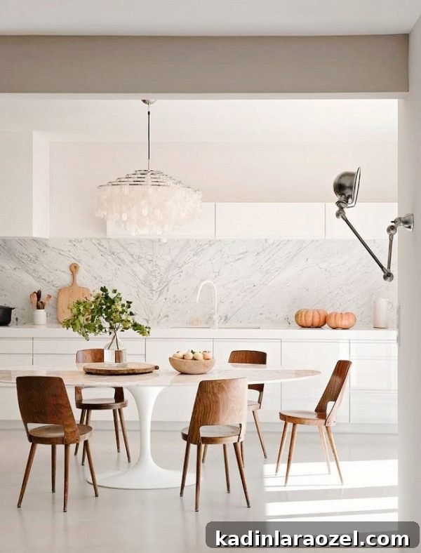 Marble + wood table and chairs combination in a dining room.