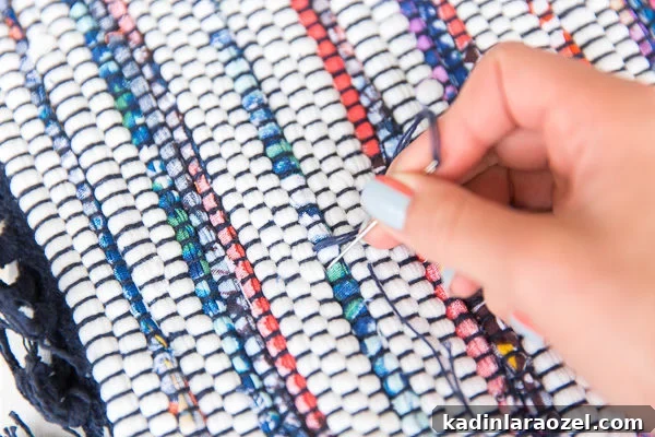 DIY Crossbody Bag for Under $10: Step-by-Step Guide 7 Sewing pieces together for a woven colorful crossbody bag.