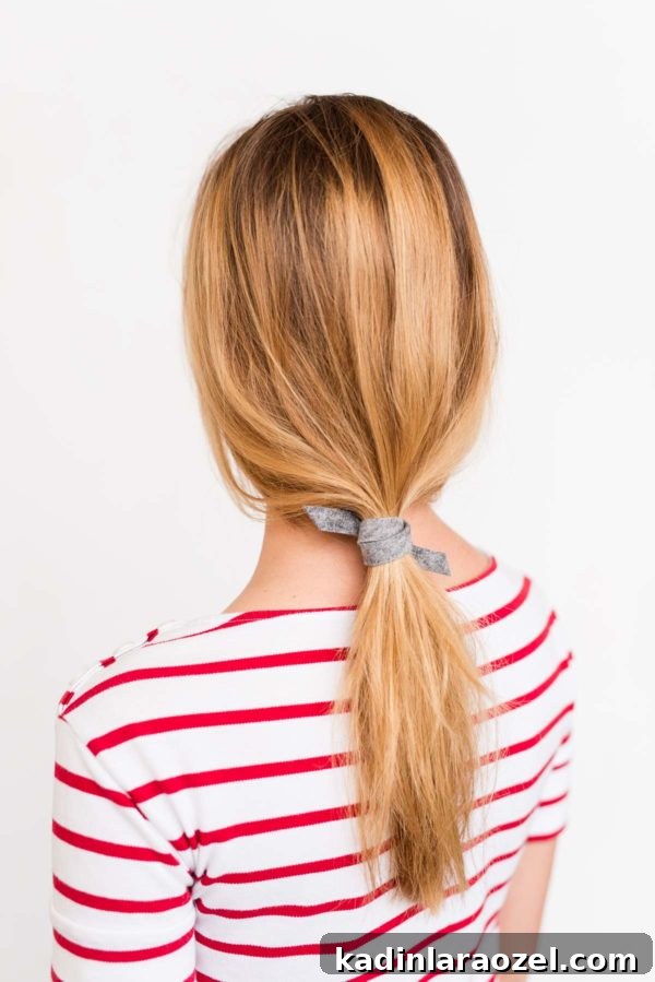 Create a Sleek Ponytail in 3 Minutes Using Felt 7 Low ponytail blonde hair, tied with felt