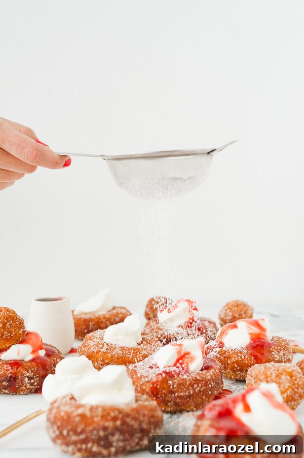 Mascarpone French Toast Donuts with Fresh Strawberry Drizzle 3 french-toast-donuts-sprinkled-powdered-sugar-1
