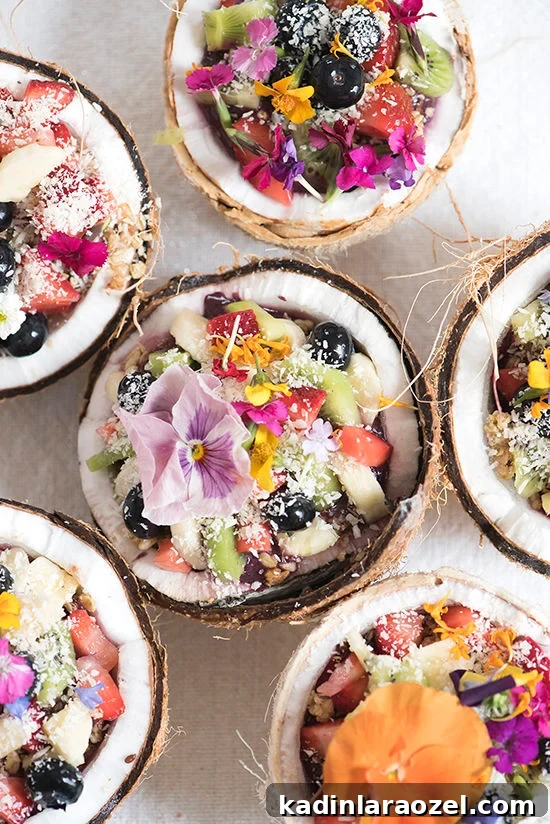 Hello Summer: 24 Irresistible Recipes for Hot Days 2 acai bowl in a coconut with edible flowers