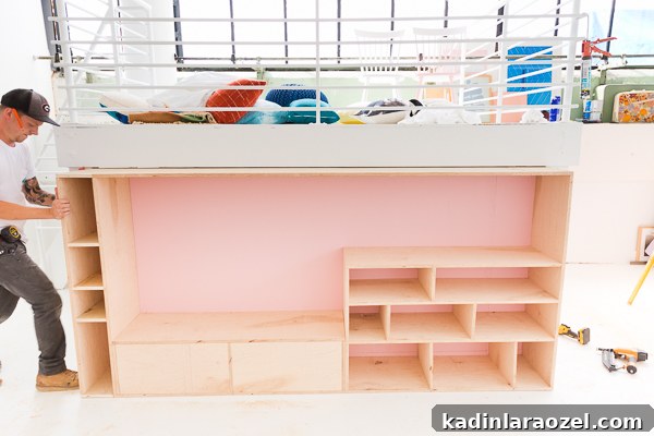 Modern Studio Makeover: DIY Seating and Storage Before & After 10 Slide unit into place