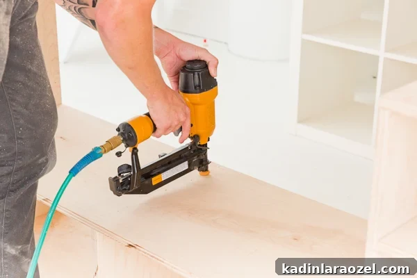 Modern Studio Makeover: DIY Seating and Storage Before & After 7 Staple gun wood frame together