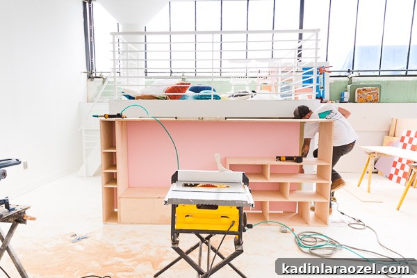 Modern Studio Makeover: DIY Seating and Storage Before & After 9 Attach faux wall to back of built-in