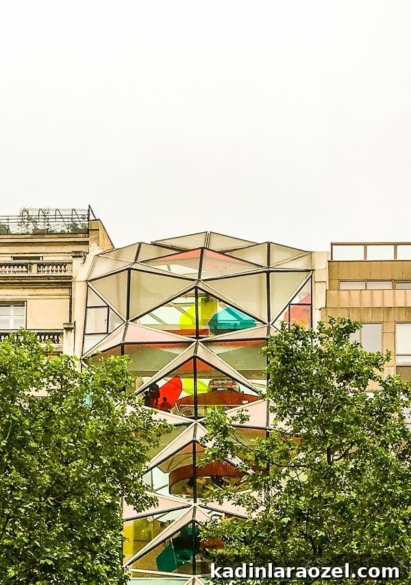 Behind the Scenes: Fruit Stacks, Dirt Spills, Breakfast Tacos & Hopper the Cat 10 A geometric glass building in Paris
