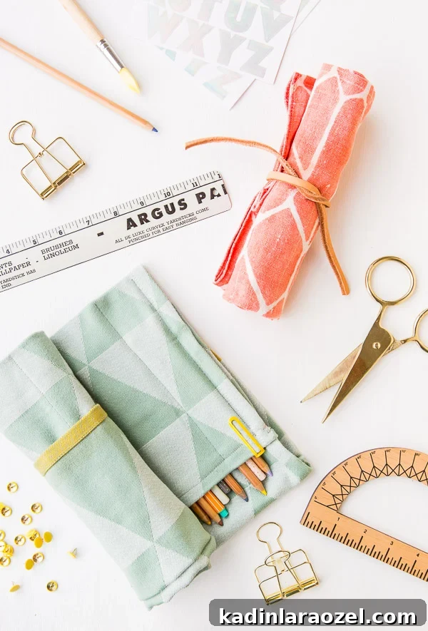 A colorful pencil organizer with pens and pencils all lined up inside.