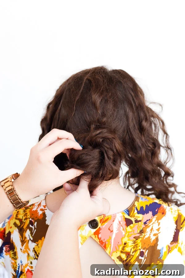 5-Minute Rope Twist Curly Updo Tutorial 4 Woman with curly brown hair, trying a char tutorial