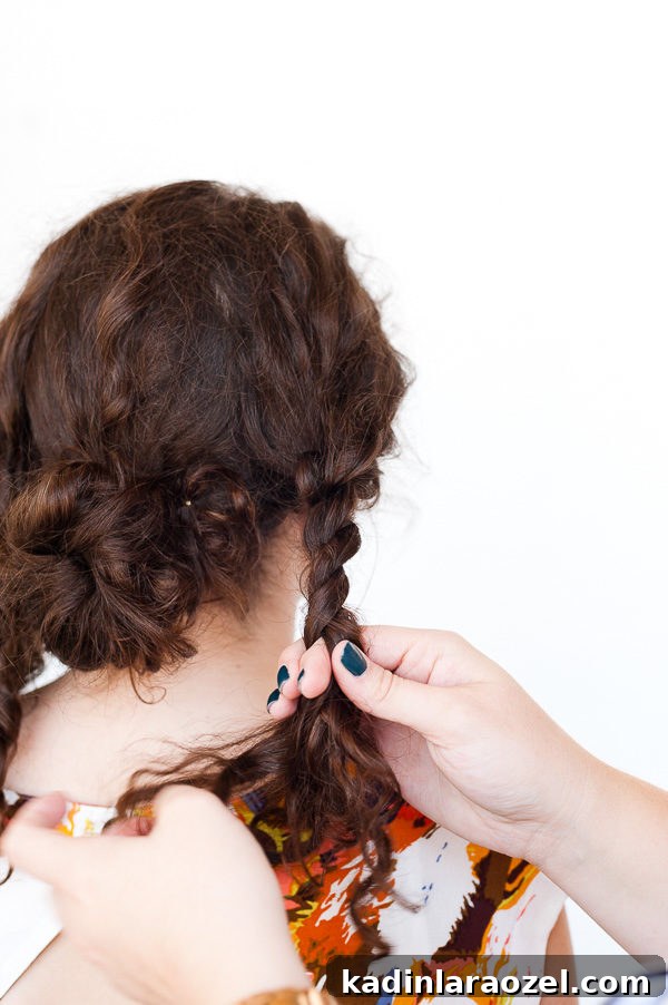 5-Minute Rope Twist Curly Updo Tutorial 6 Twisting curly hair into sections to create curly hair updo