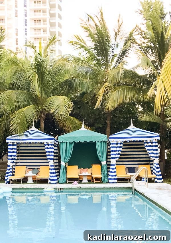 72 Hours in Miami: A 3-Day Itinerary for Food, Beaches & Nightlife 3 Striped gazebo tents lined up next to a large outdoor pool in Miami