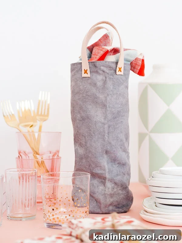 Festive DIY Canvas Wine Bags for Holiday Hostess Gifts 5 Canvas wine tote sitting on table with glassware and other bar cart items
