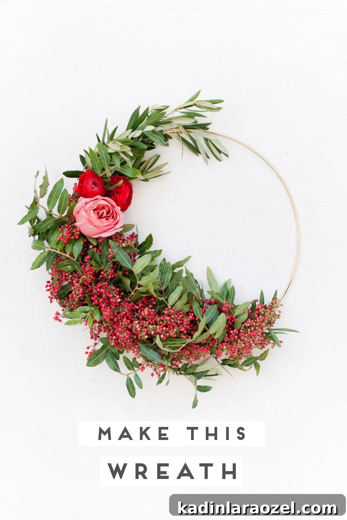 Create an Asymmetrical Wreath: Step-by-Step Design Guide 2 Unique holiday wreath made of red berries, pink flowers, and greenery.