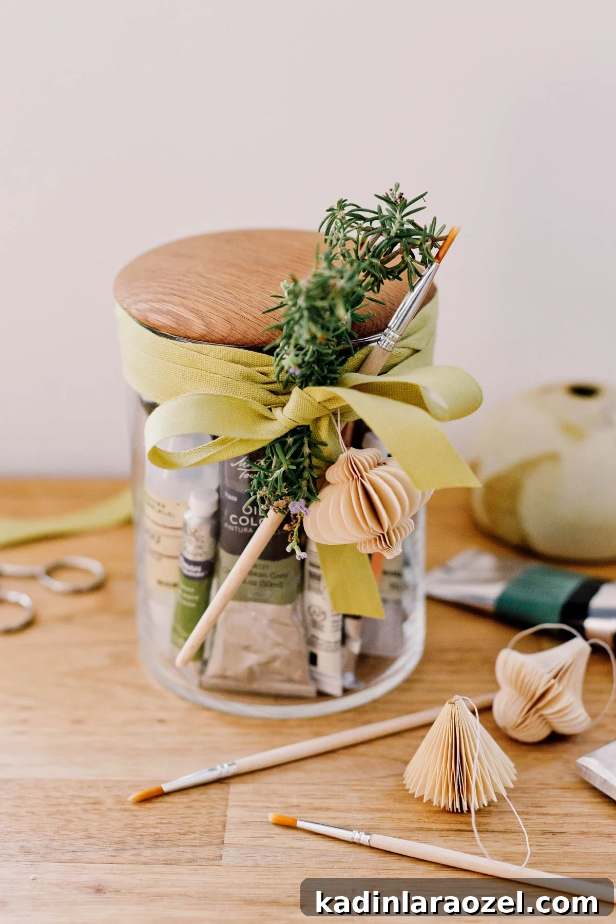 Mason jar with artist supplies inside