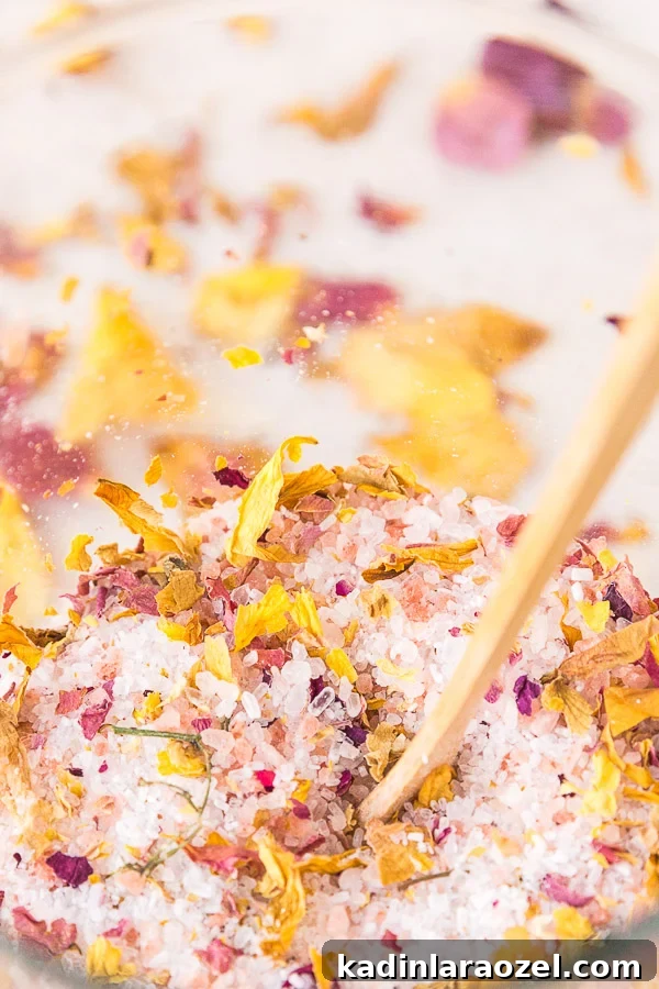 How to Dry Rose Petals and Make Rose Petal Bath Salts 10 closeup of rose petal bath salts in glass container with tiny floral confetti mixed in