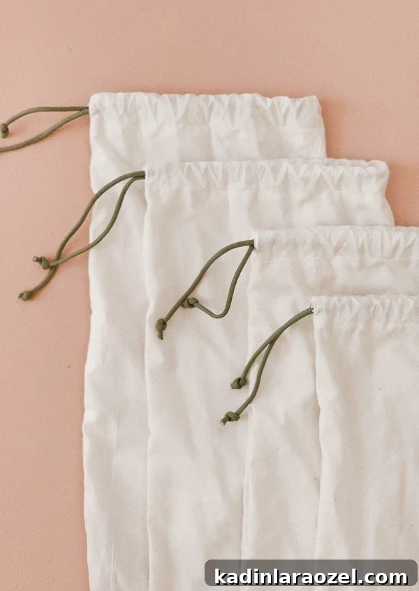 49 Clever DIY Home Organization Ideas to Maximize Space 13 Minimal produce bags with green drawstring on pink background