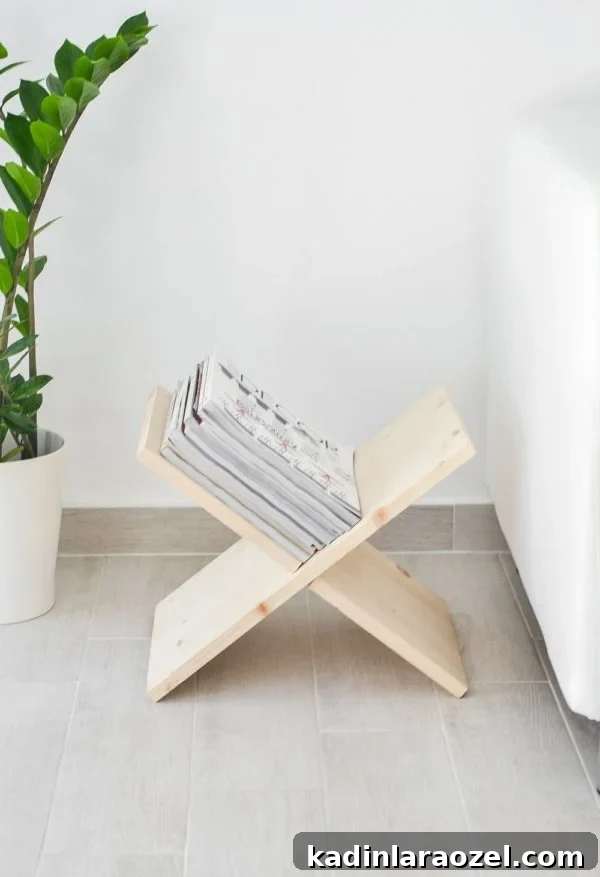 49 Clever DIY Home Organization Ideas to Maximize Space 14 A wood magazine rack shaped like an X for storage, sits next to a couch.