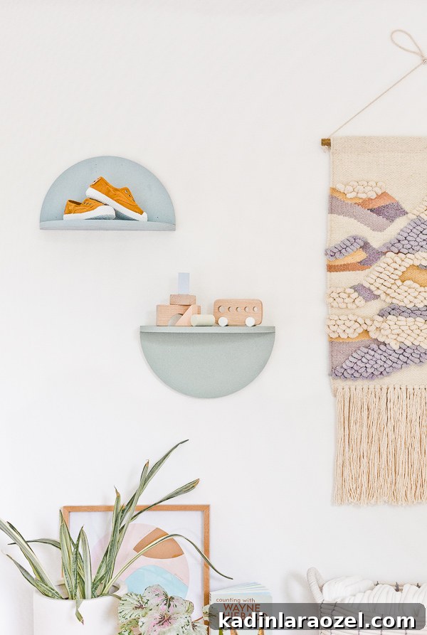 49 Clever DIY Home Organization Ideas to Maximize Space 26 Pastel half circle wall shelves hanging in a gender0neutral nursery.