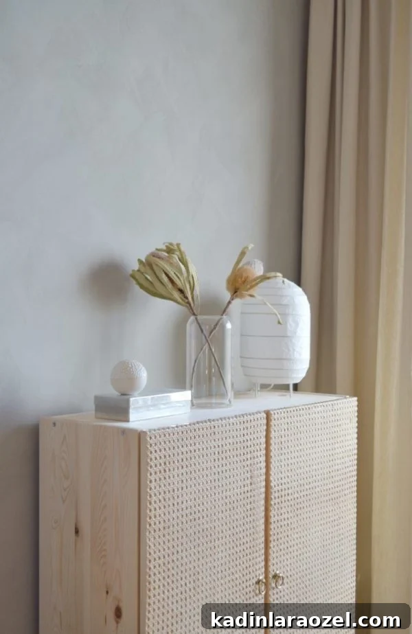 49 Clever DIY Home Organization Ideas to Maximize Space 37 A wood cabinet Ikea hack that stores clutter behind closed doors.