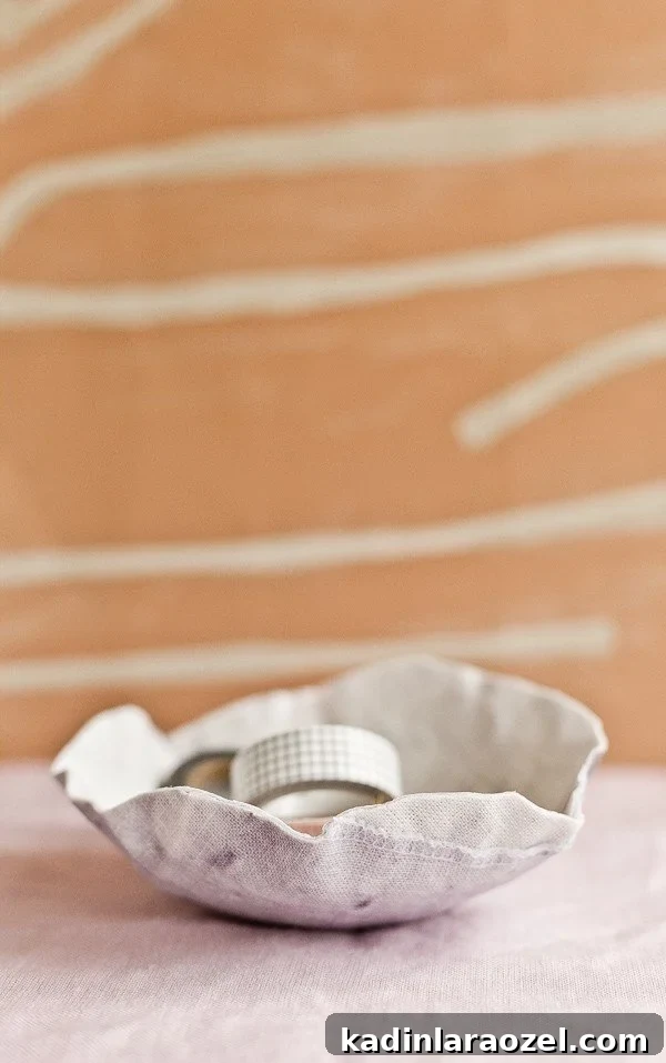 49 Clever DIY Home Organization Ideas to Maximize Space 10 Organic shaped bowl made of fabric with rippled edges, sitting on tablecloth