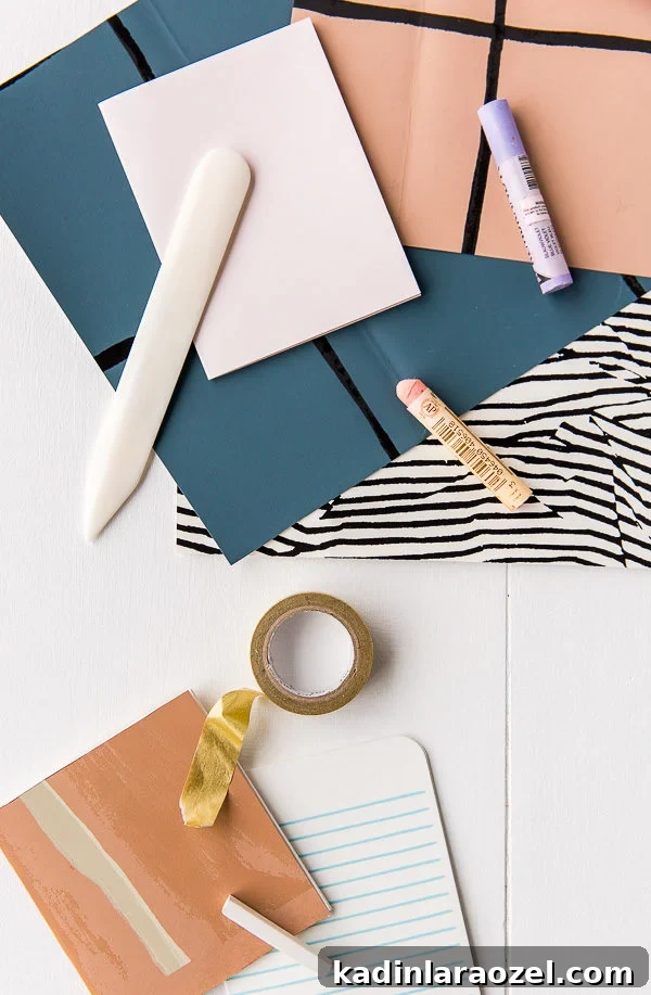 DIY Notebooks in 5 Minutes: Two Simple Paper-Binding Methods 7 Wallpaper scraps and craft supplies on a table to make notebooks.