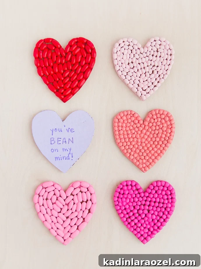 49 Creative DIY Valentine Gift Ideas for Loved Ones 17 heart shaped valentines made with painted beans in different shades of pink