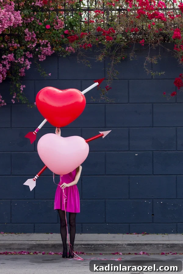 49 Creative DIY Valentine Gift Ideas for Loved Ones 27 cupids arrow valentines day balloons being held by woman wearing pink dress