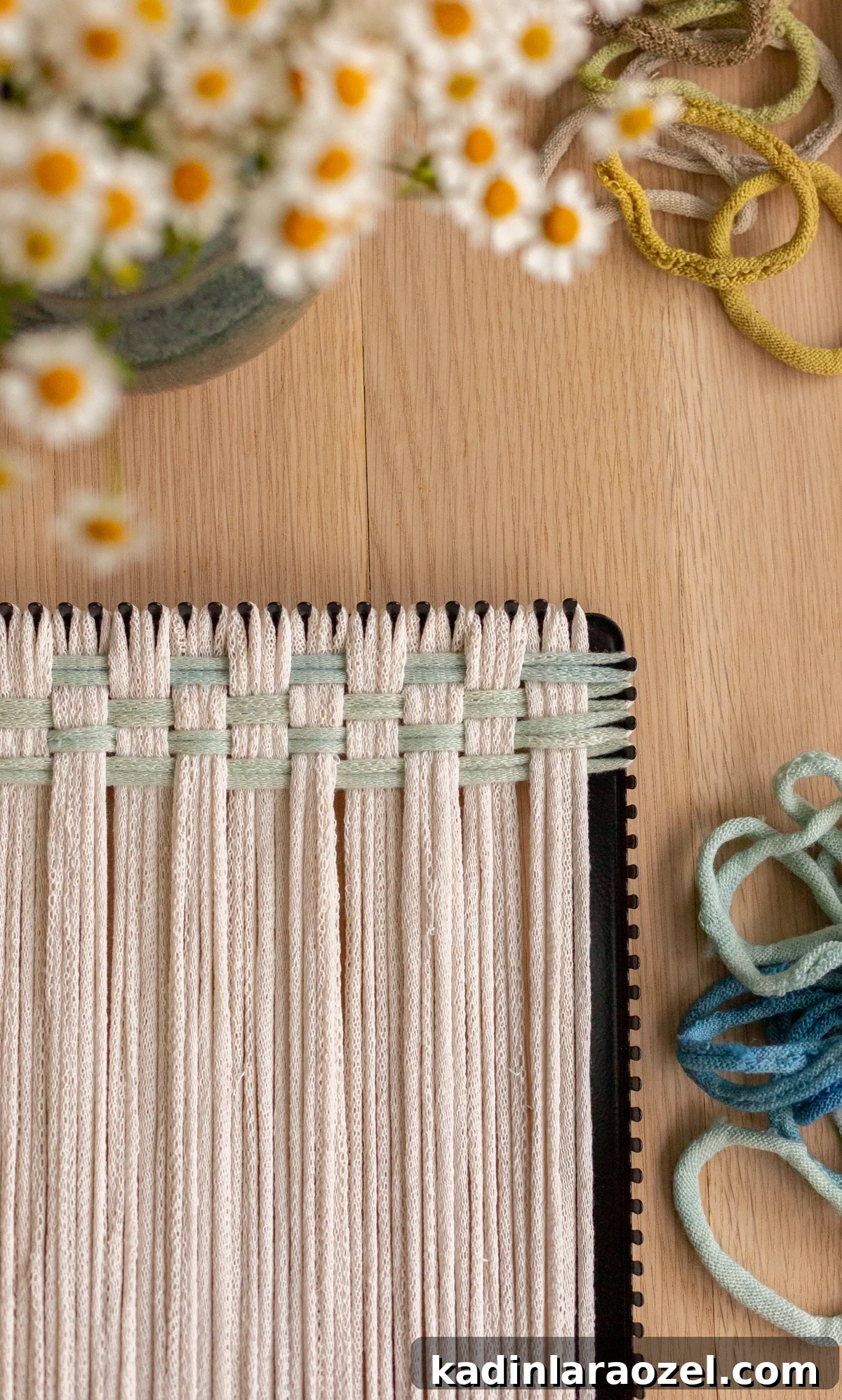 49 Creative DIY Valentine Gift Ideas for Loved Ones 28 overhead of a potholder being made on a potholder loom with cream and blue loops
