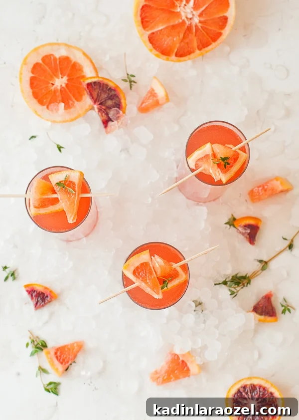 49 Creative DIY Valentine Gift Ideas for Loved Ones 44 overhead view of blood orange cocktail with orange slices on ice