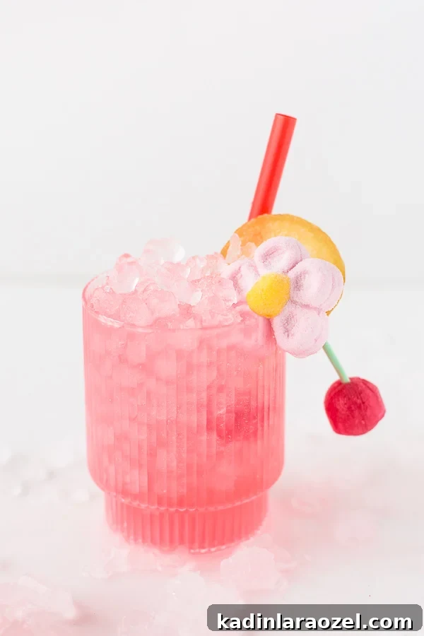 49 Creative DIY Valentine Gift Ideas for Loved Ones 48 pink cocktail in short ribbed glassware with candy garnish and red straw