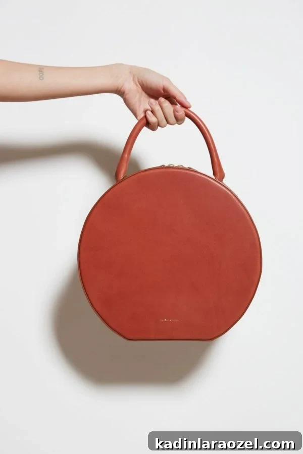 Always into a Mansur Gavriel leather circle bag.