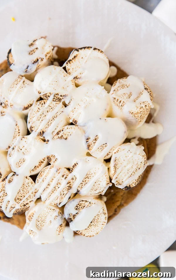 S'more pizza with toasted marshmallows and vanilla glaze