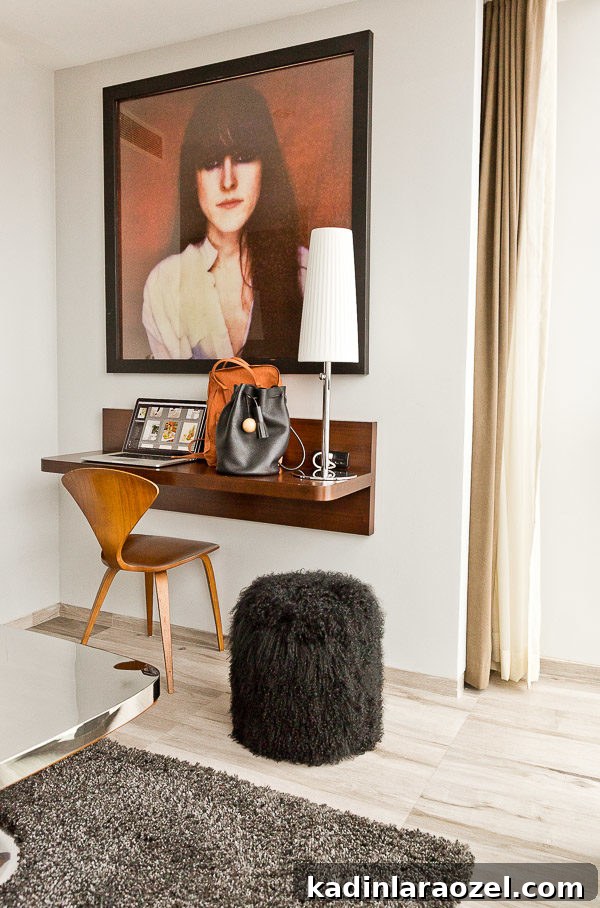 A space-saving desk and a furry pouf at Hotel on Rivington in NYC