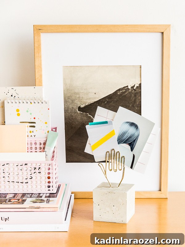Modern workspace with warm wood desk and concrete paperweight