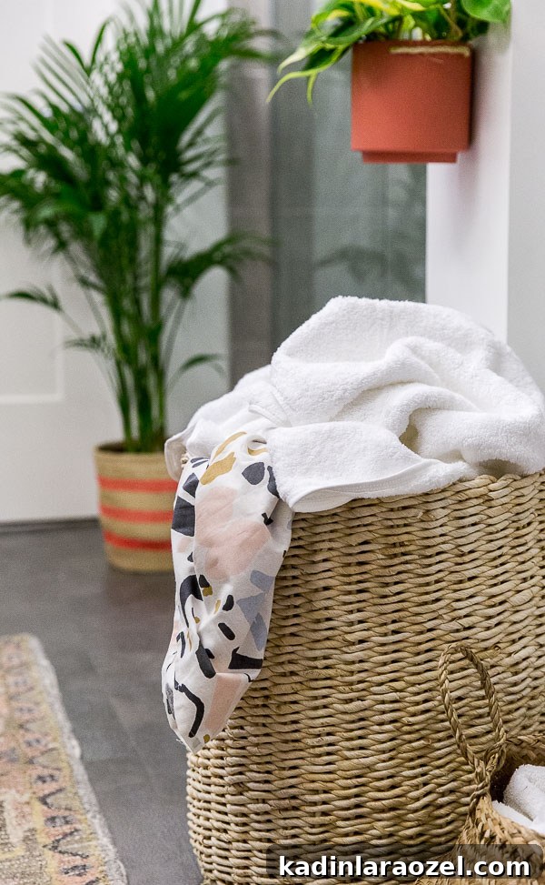 Before and After: My New Master Bathroom Remodel Reveal 13 Use a large basket as a hamper in the bathroom for easy access to dirty clothes, etc. Click through for more tips and a before and after minimal modern bathroom makeover.