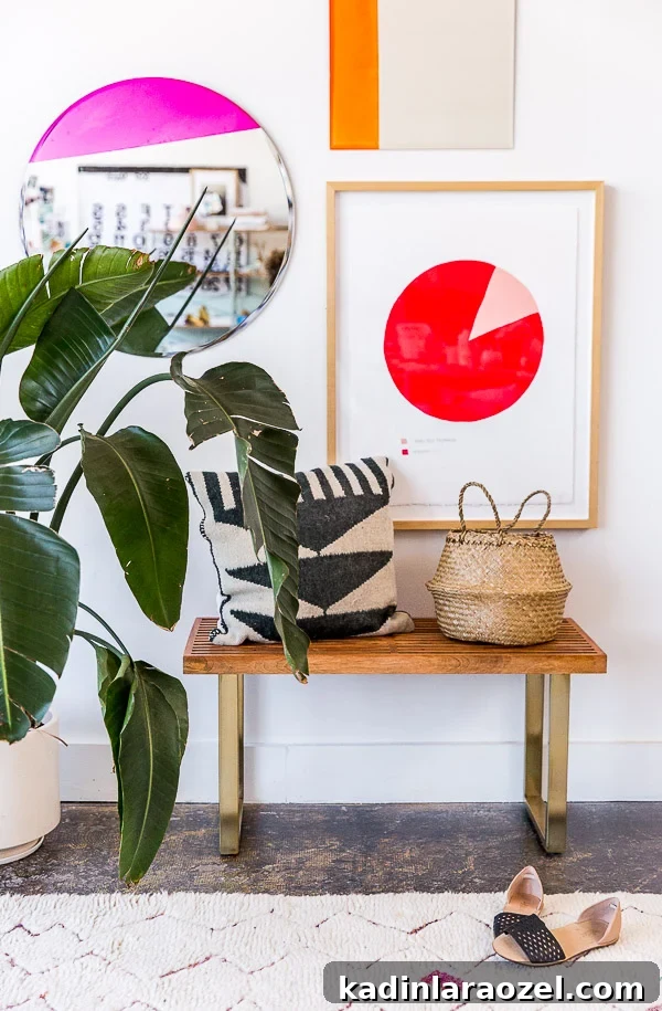 Color blocked DIY mirrors hang in a modern entryway