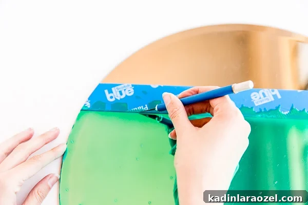 Using a sharp knife to create sharp edges for color blocked mirror