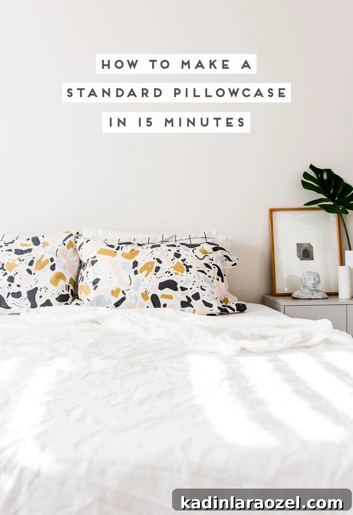 Minimal white bedding and bold pattern pillowcases and simple nightstand