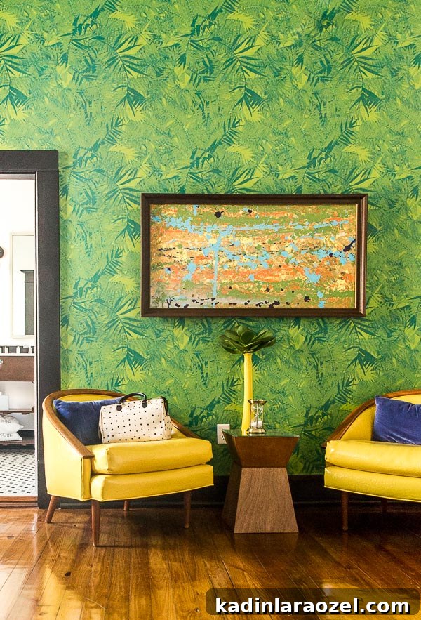 Tropical vibes with yellow chairs and palm frond wallpaper