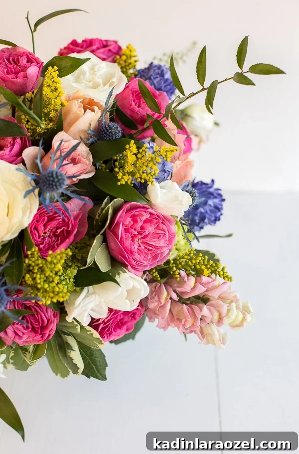 Inside the Studio: Stripe Design, Style Guides & Shoe Production 6 A colorful floral centerpiece with garden roses, hyacinth, thistle, stock, and more.