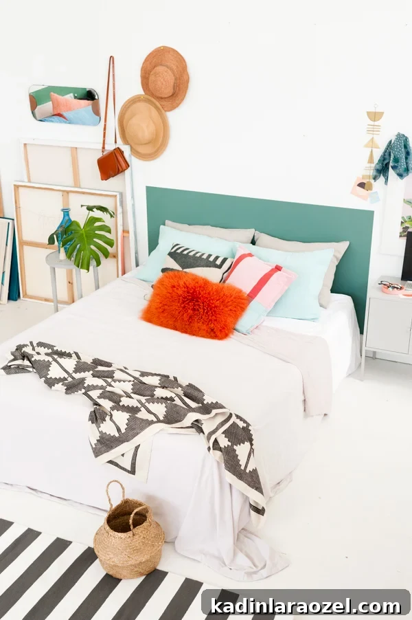 One-Hour DIY Headboard Project: Stylish Design You Can Build Now 18 An artsy loft bedroom with painted green headboard