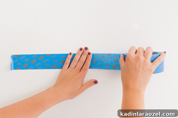 One-Hour DIY Headboard Project: Stylish Design You Can Build Now 9 Taping off headboard on wall