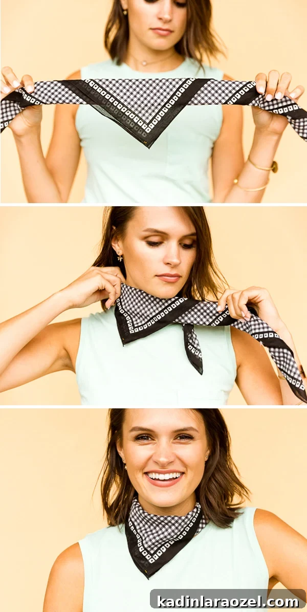 Photo of brunette woman tying a black bandana into the mini neck bib style.