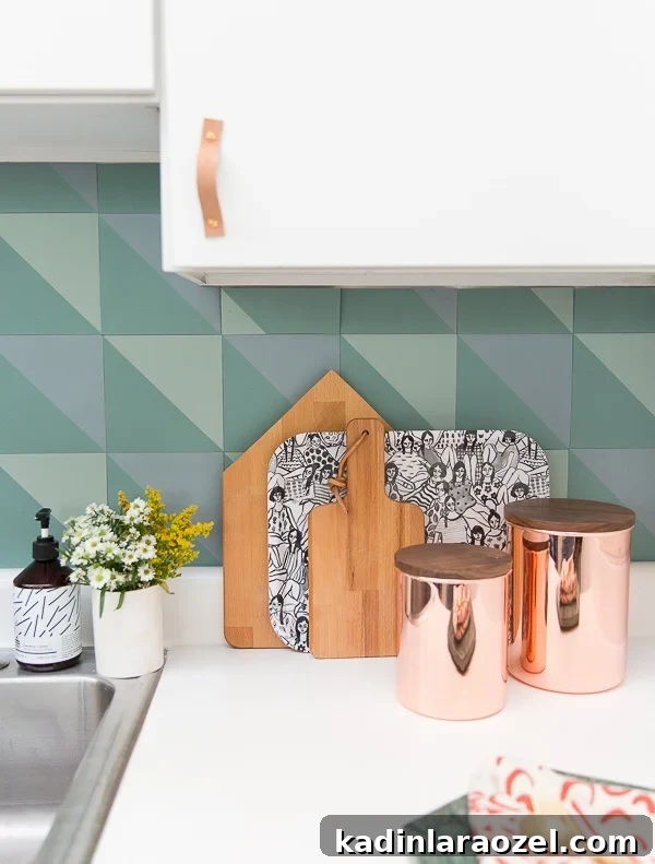 Resurface Laminate Countertops Yourself for Under $50 3 All white kitchen with bold pattern backsplash and newly resurfaced white laminate countertops.
